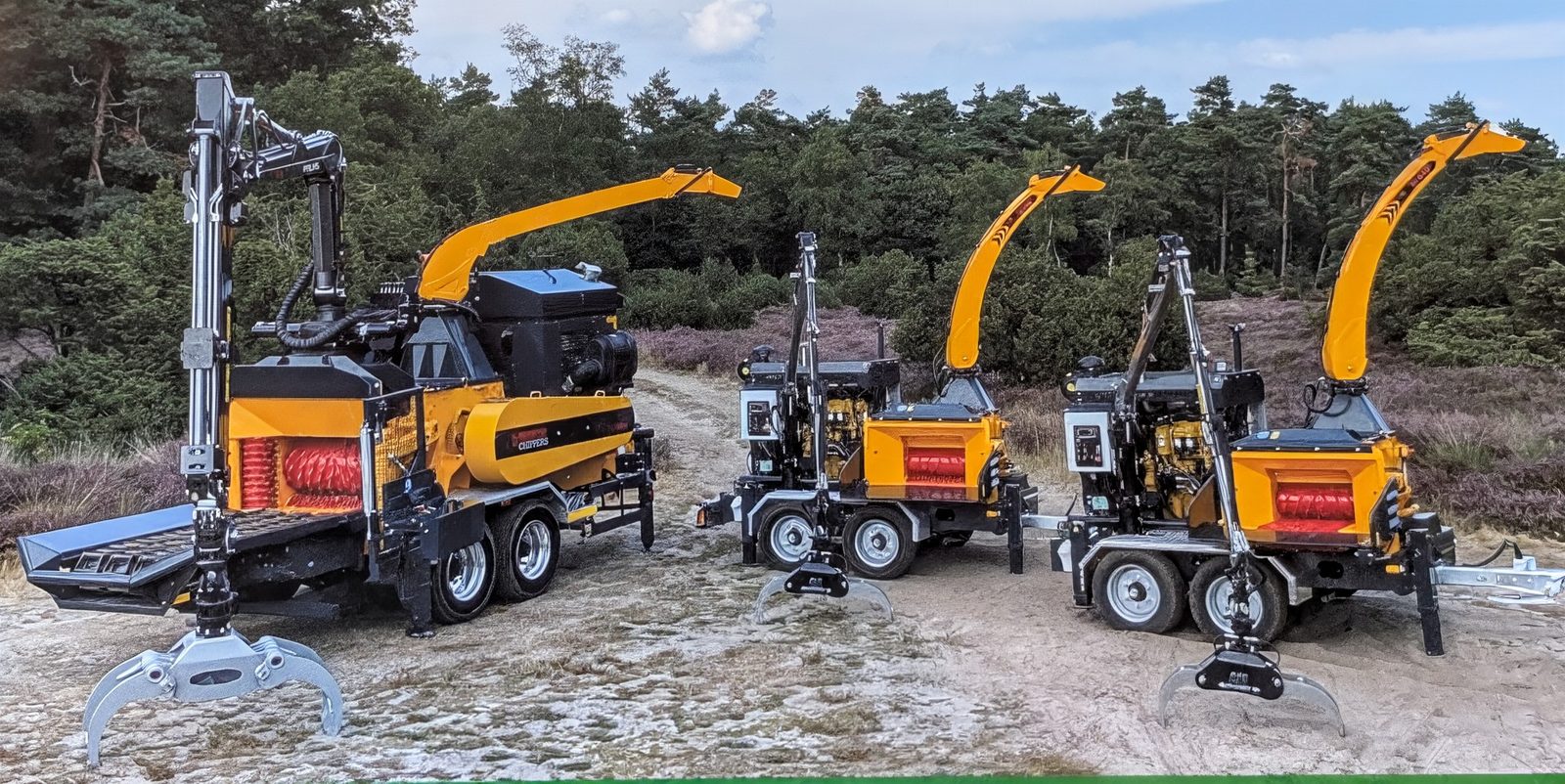 Europe Forestry EC drum chippers lineup in forest setting